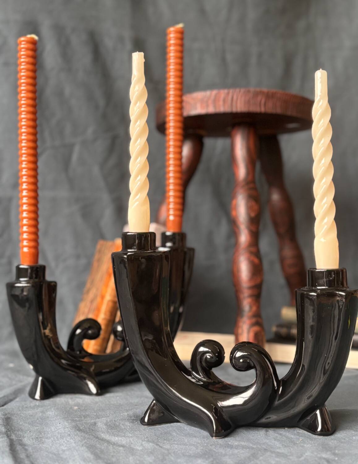 2 black ceramic candle holders