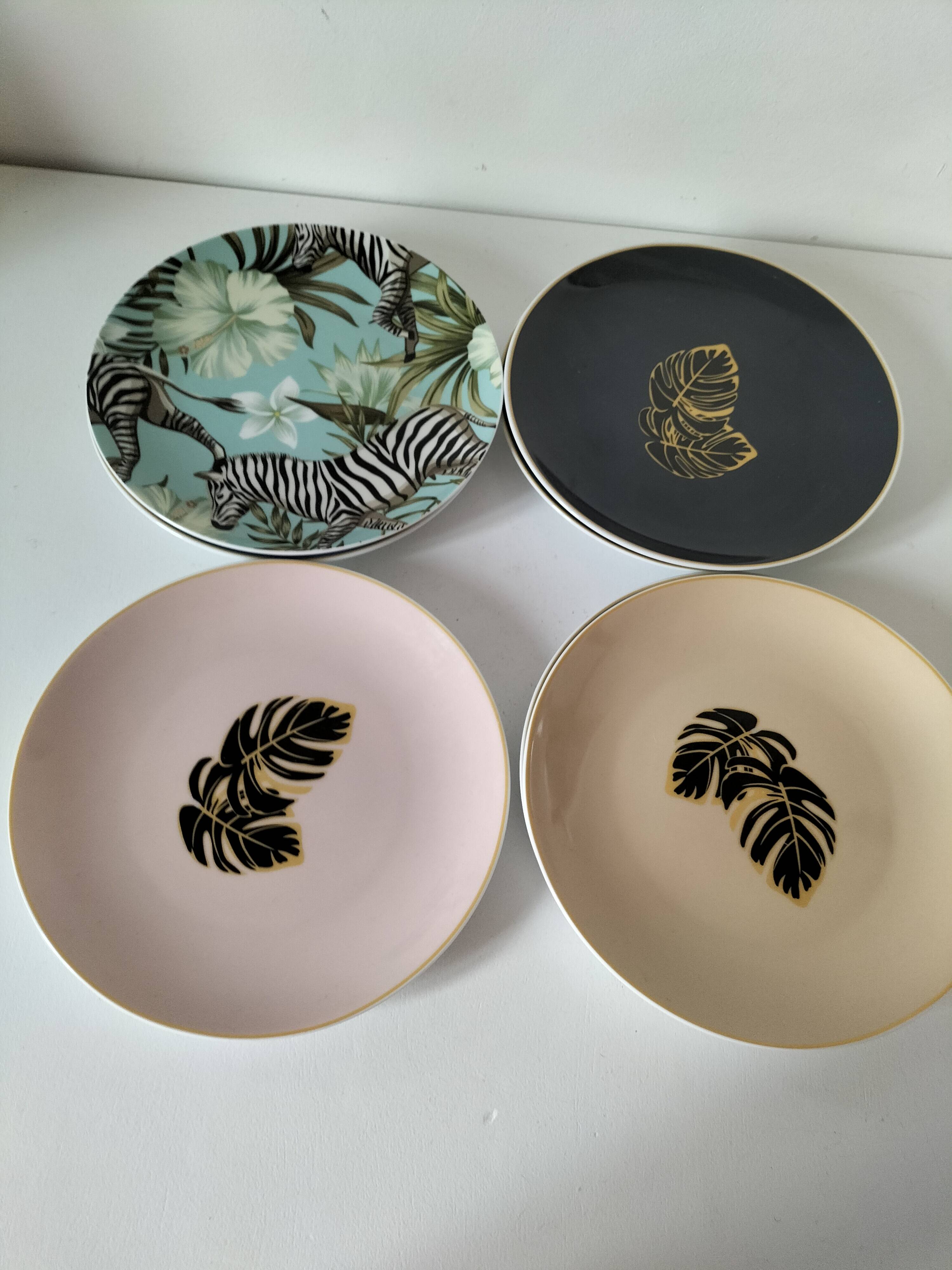 Set of 7 porcelain plates, gold foliage & jungle