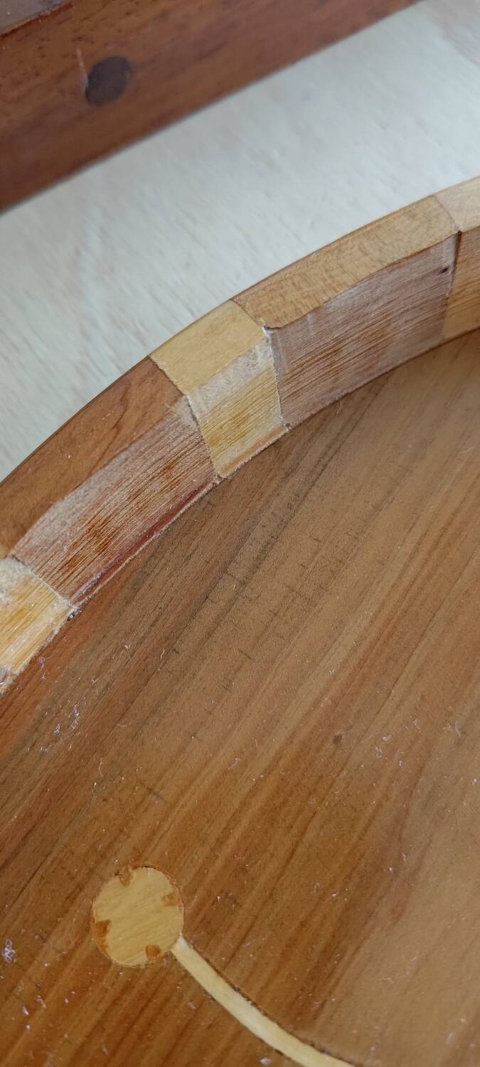 Inlaid wood top.
