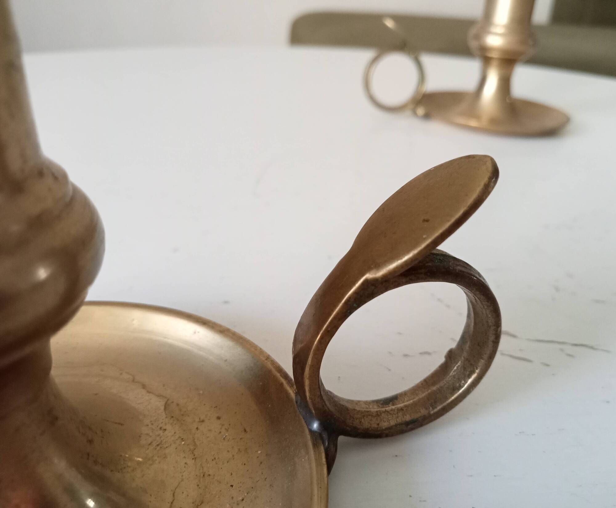 Antique hand candlestick in solid gilded brass.