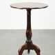 Round antique side/wine table from the late 18th century with a subtle foot
