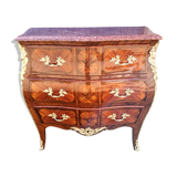 Louis XV jumping chest of drawers curved in precious wood marquetry.