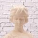 Bust of a young woman in cracked white porcelain.