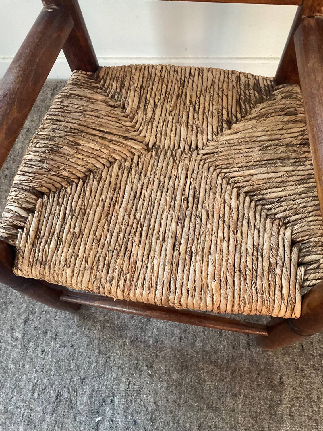 Vintage wooden armchair and straw seat for children