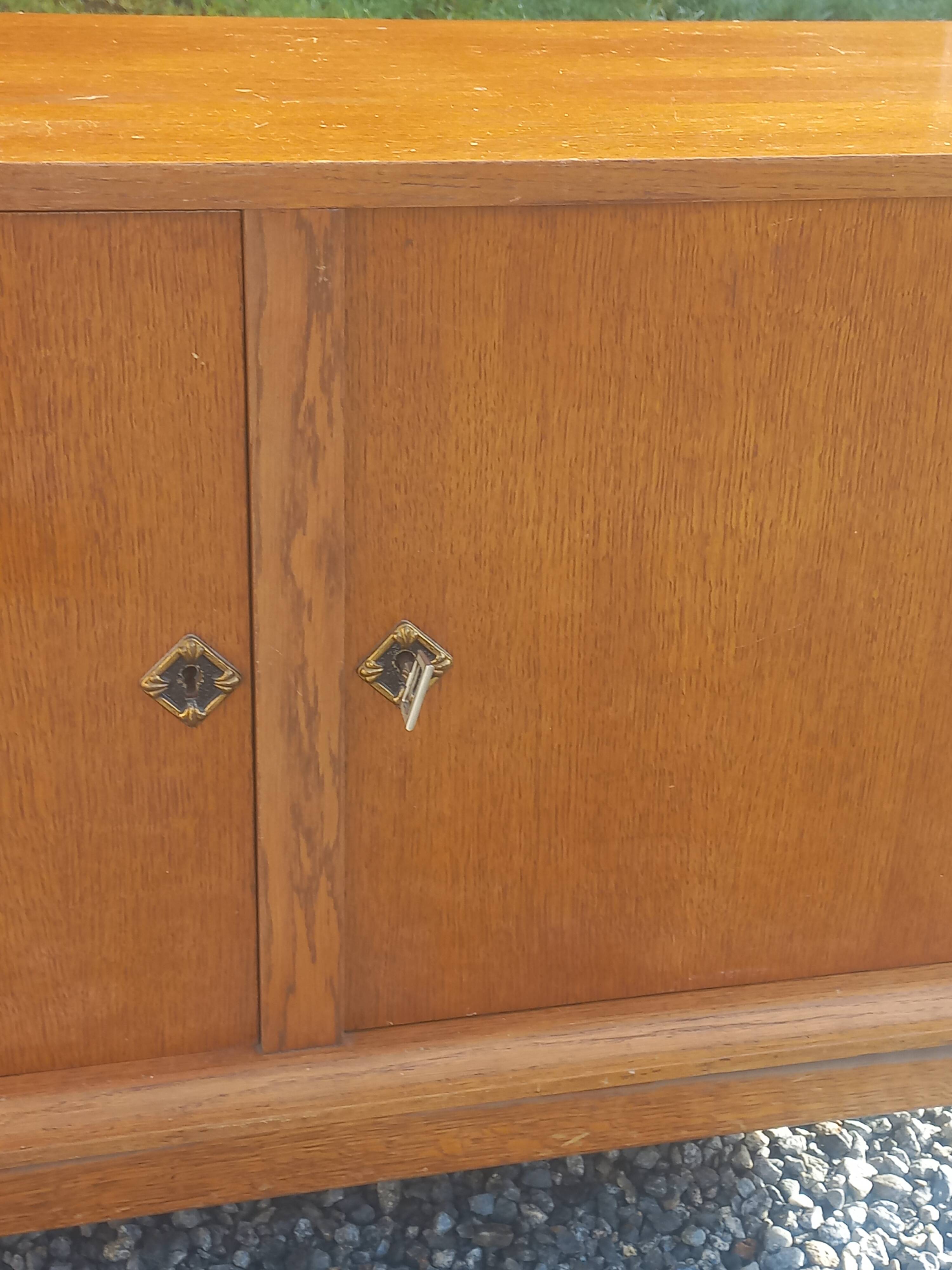 Vintage oak sideboard with splayed legs from the 1950s.