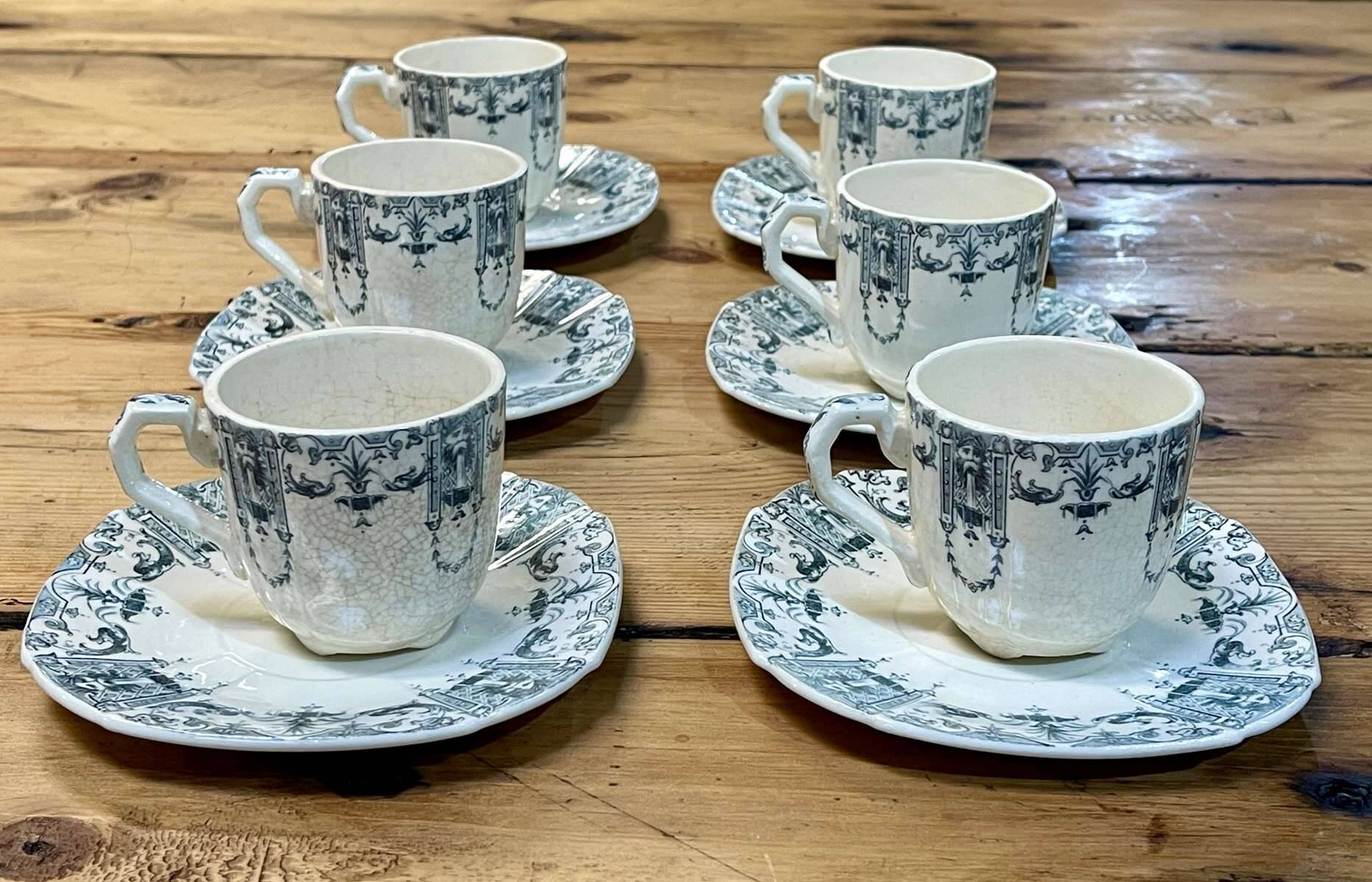 6 cups and saucers in Gien earthenware with Mascaron decoration from the early 20th century.