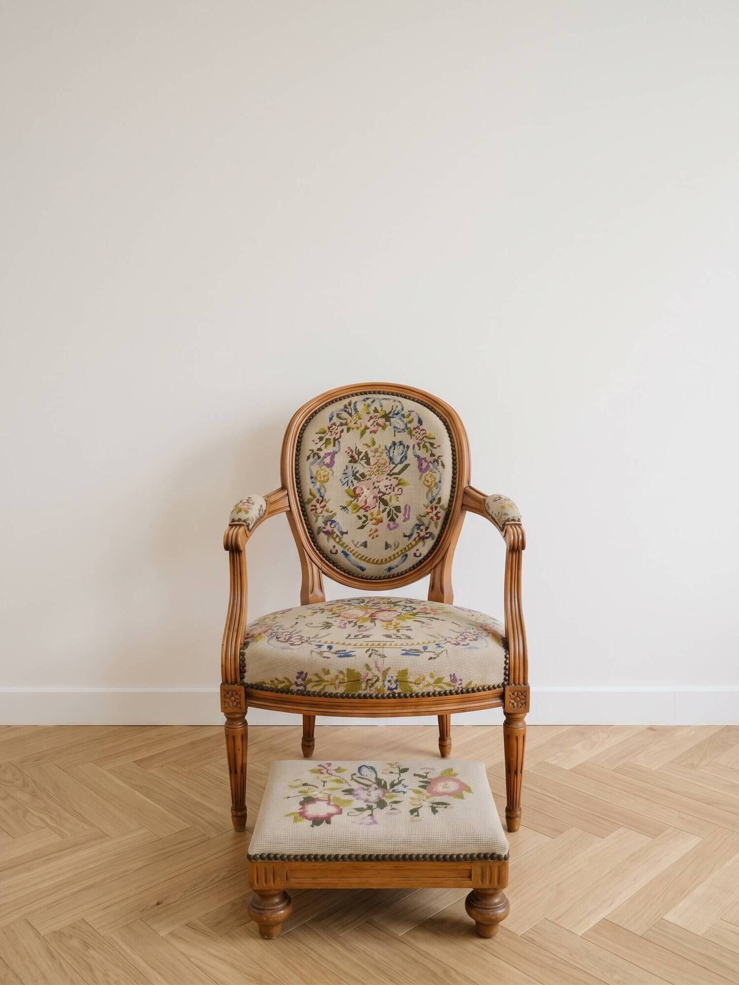 Armchair and footrest set in Louis XVI style