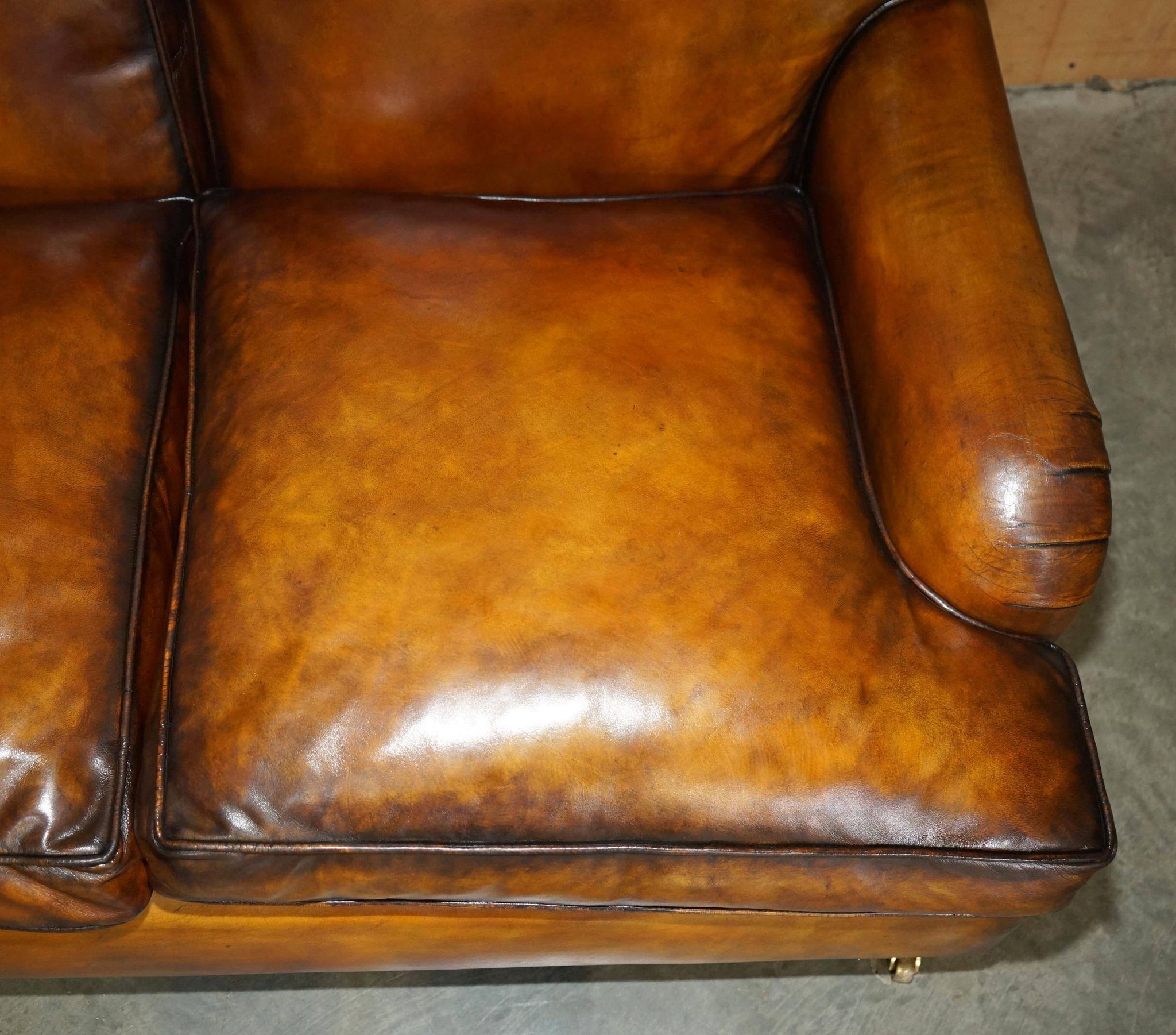 Howard & Son restored leather canapé, width 145 cm