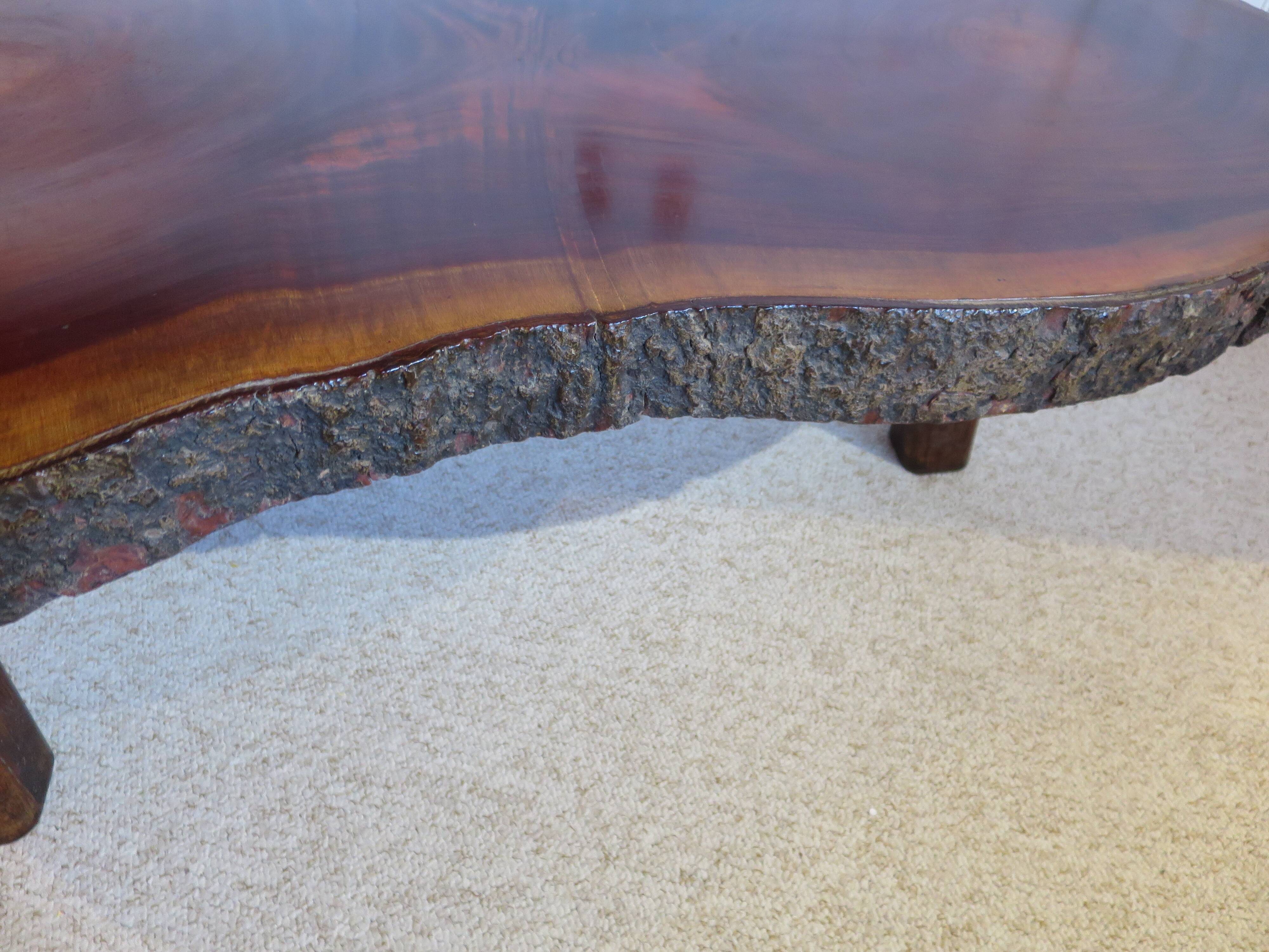 Tripod coffee table - solid okoumé wood - organic shape - brutalist style