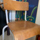 Old wooden and metal children's school chair