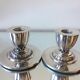 Paire de porte-bougies plaqués en argent art déco