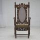Fauteuil danois à haut dossier des années 1930, en maille, velours et bois de chêne sculpté.