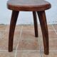 Low tripod stool in solid wood, design by Henri Bataille, 35 cm