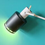 Pair of long white arm wall lights with black spot. "lita device"