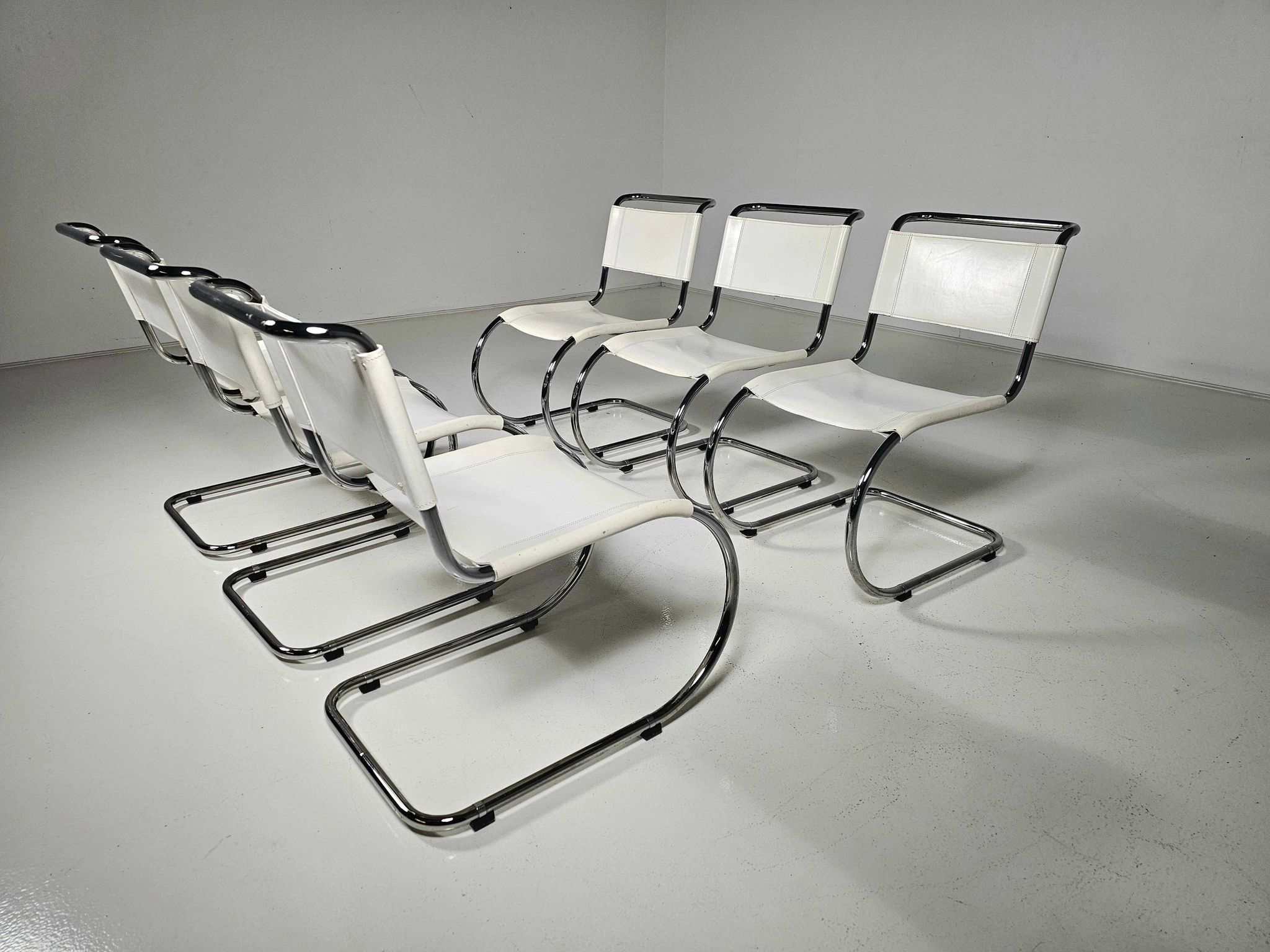 Set of 6 white cantilever dining chairs MR10 by Mies van der Rohe for Thonet, 1980s.
