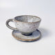 Handcrafted stoneware cup and its saucer – Speckled glaze
