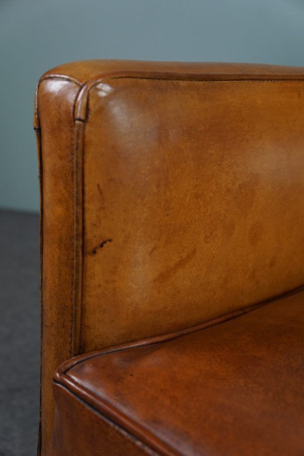 Modern charming armchair in sheepskin