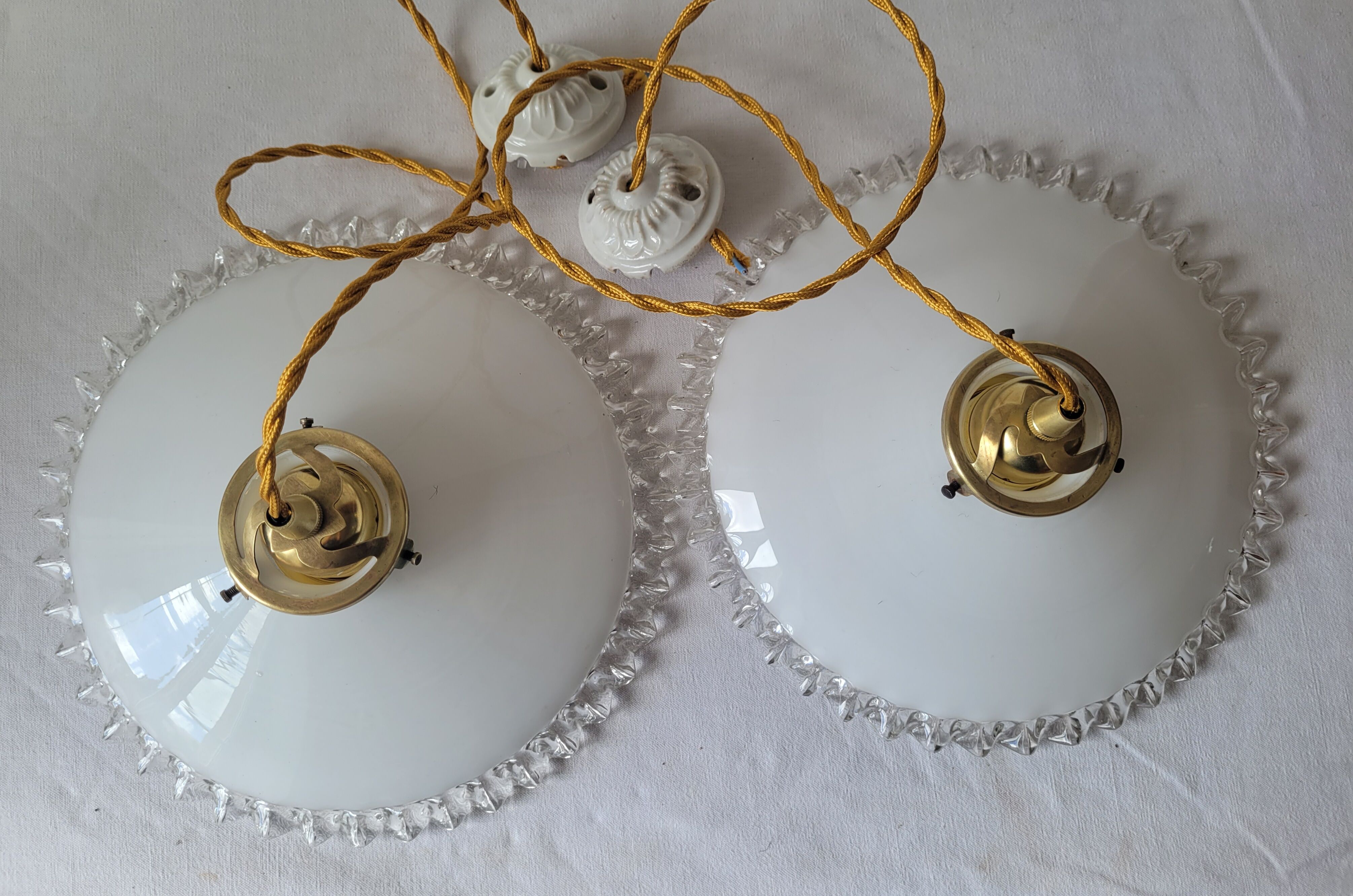 Duo of serrated opaline suspensions