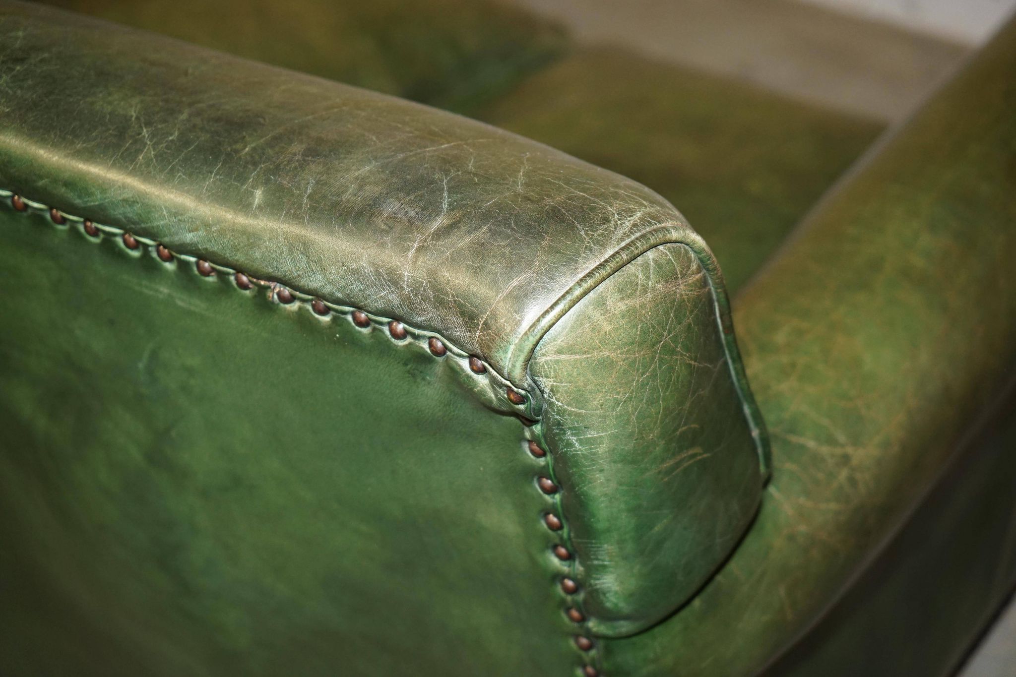 Victorian leather canapé, shield armrests, stamped Maple & Co.