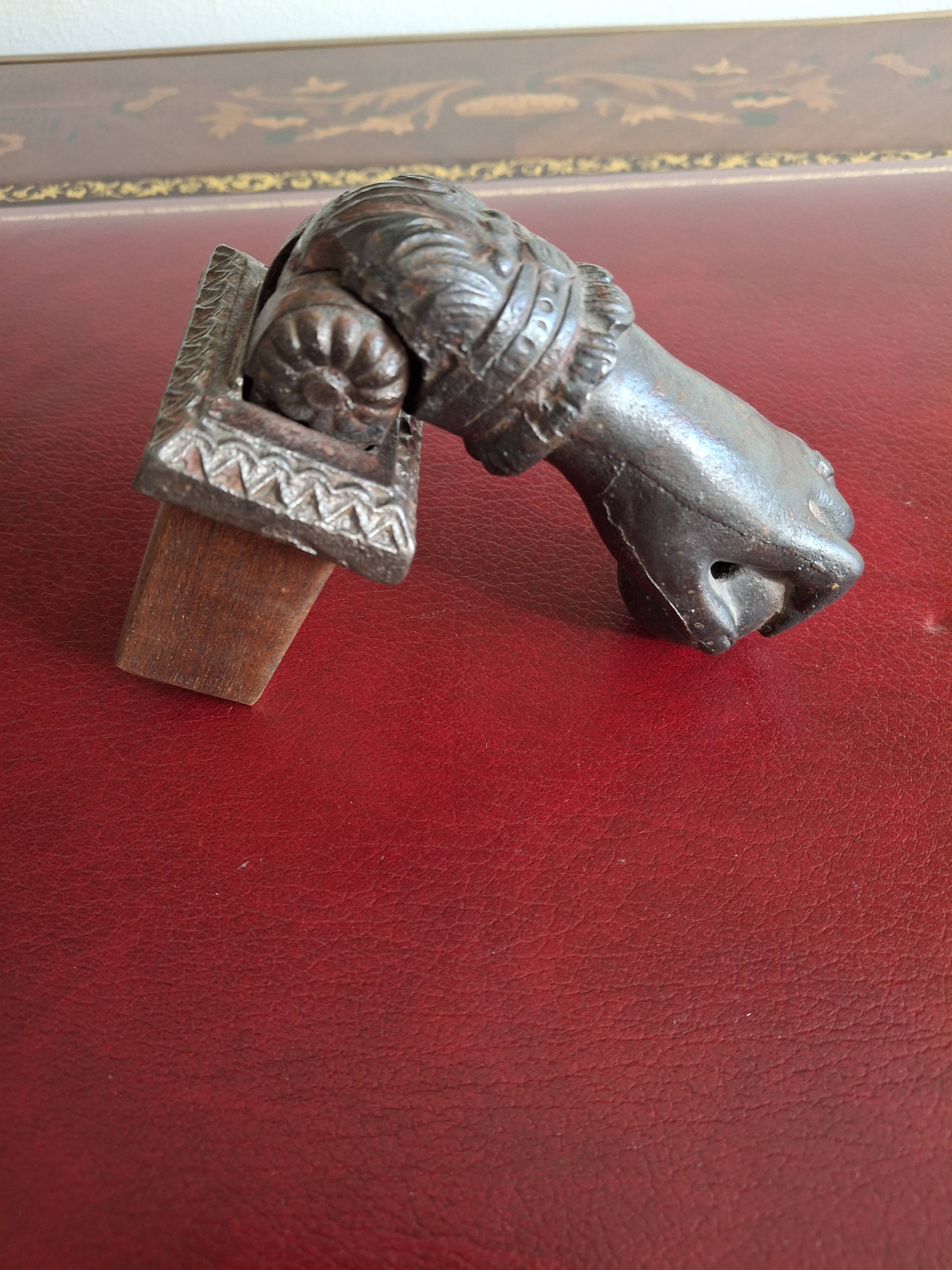Cast iron door knocker from the 19th century or earlier.