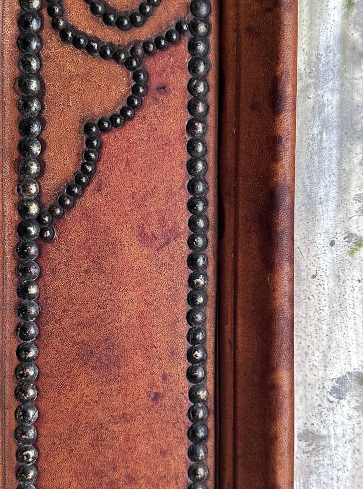 Antique mirror designed by "Pierre Lottier". Leather and nails. France 1