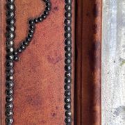 Antique mirror designed by "Pierre Lottier". Leather and nails. France 1
