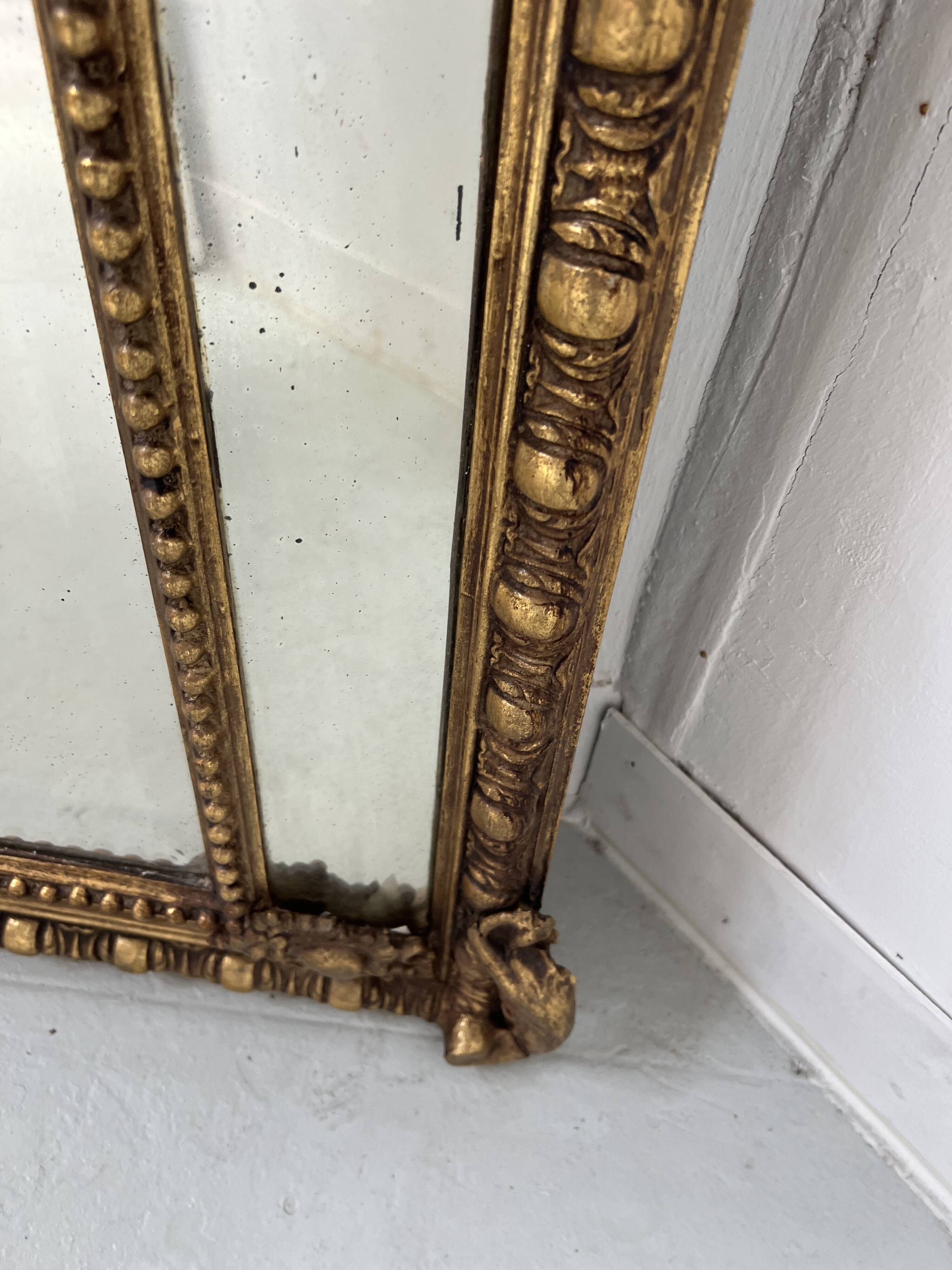 Louis XVI style mirror with parecloses in wood and gilded stucco, 19th century