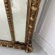 Louis XVI style mirror with parecloses in wood and gilded stucco, 19th century