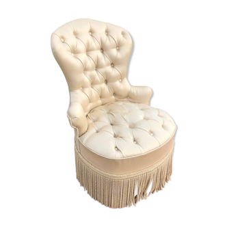 Fauteuil crapaud en satin capitonné