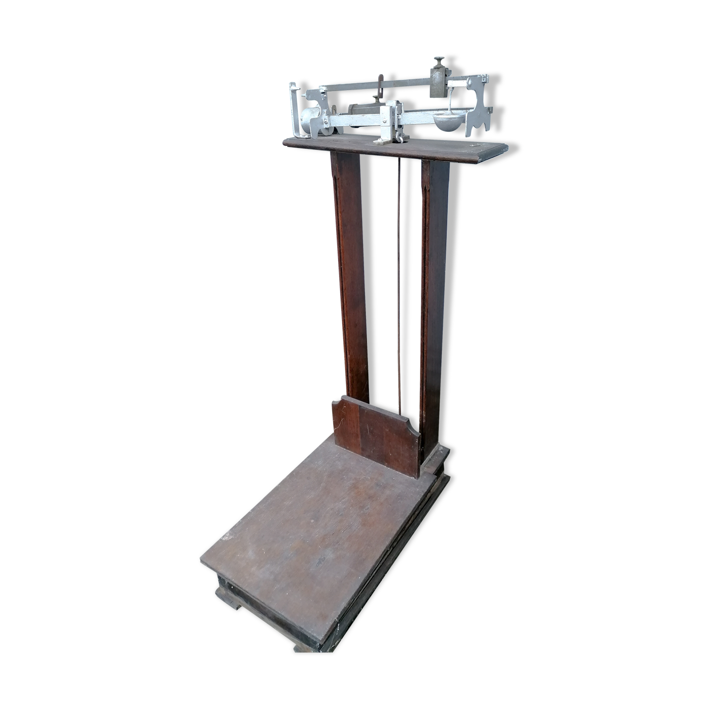 Old scale at pharmacy wood house rongier weighs person
