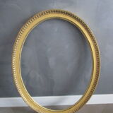 Old oval frame in gilded wood
