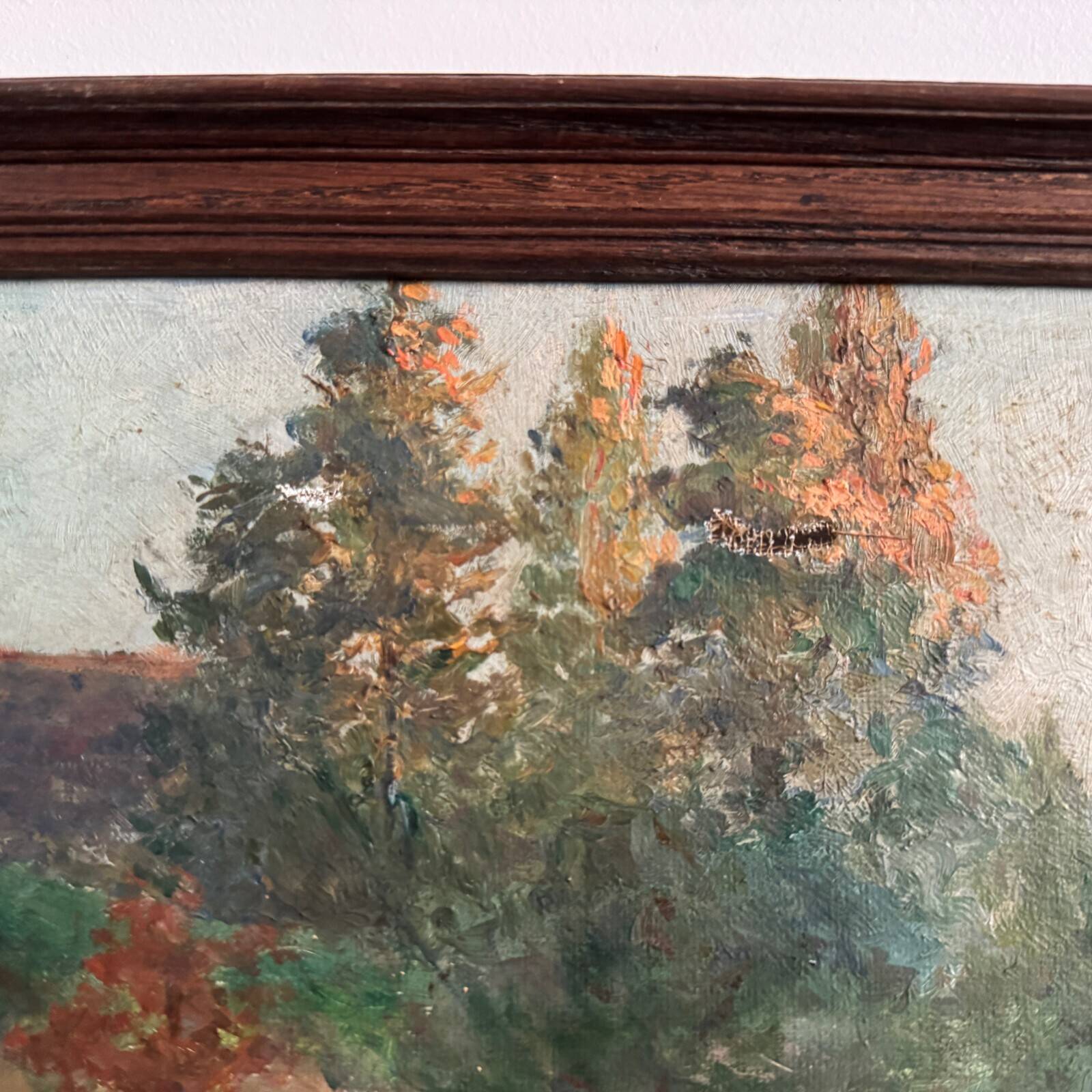 Oil on canvas park scene with a woman sitting in an armchair