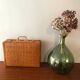 Vintage braided wicker suitcase