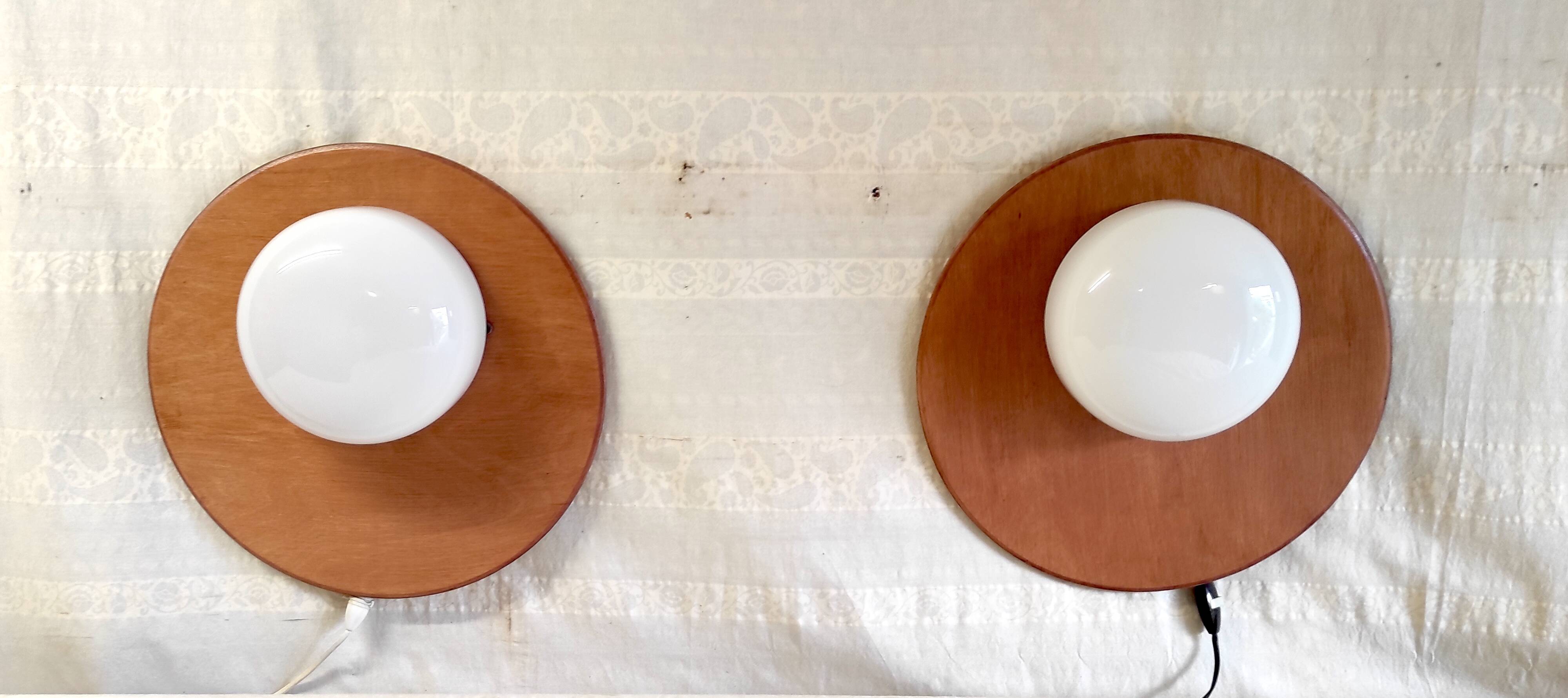 Globe-shaped wall sconces in opaline glass and wood - mid-20th century