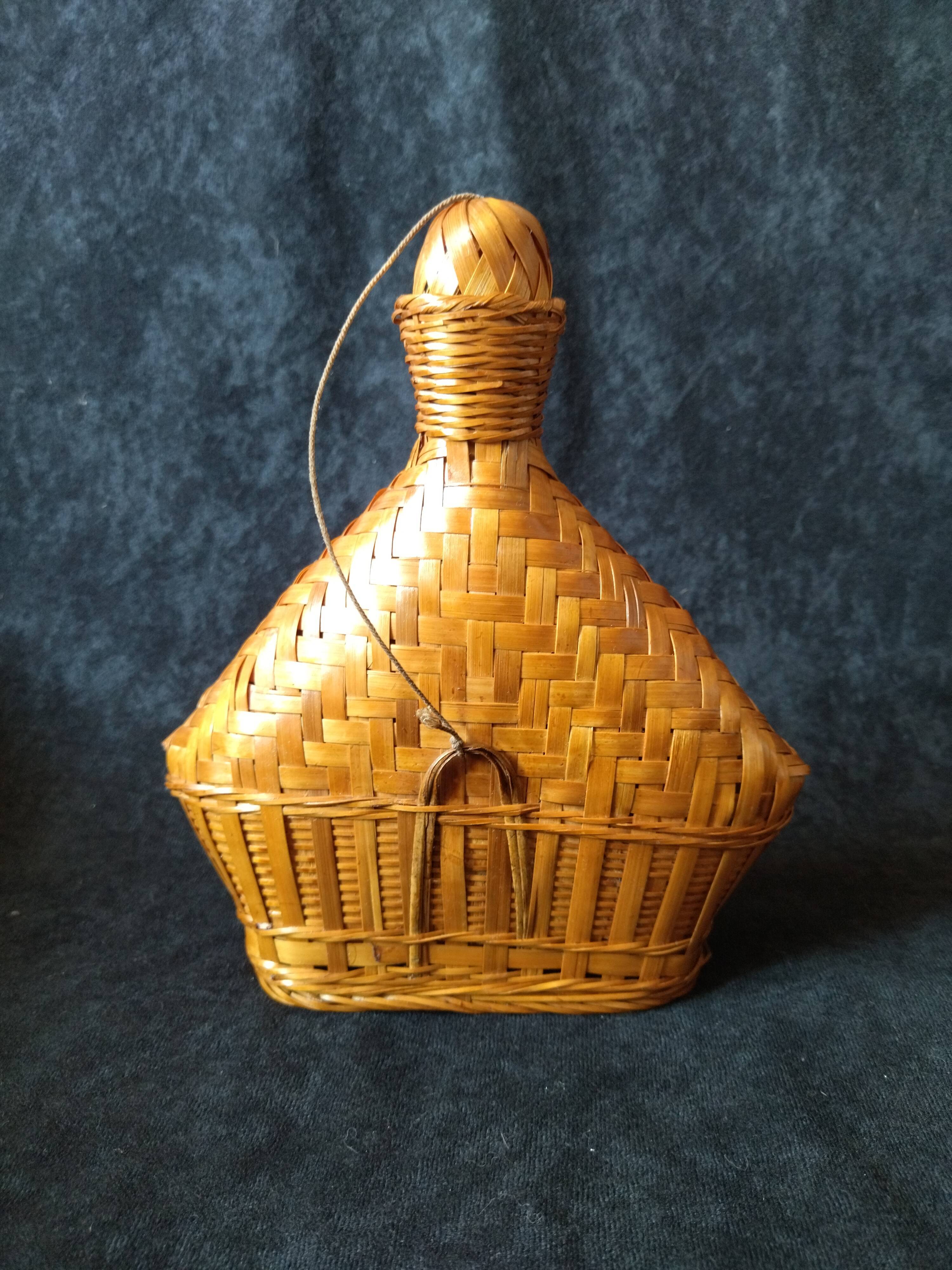 Vintage wicker and braided bamboo bottle