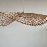 Rattan suspension or lighting fixture in the shape of an undulating circular tray with lattices