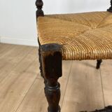 Corner chair in carved wood and straw, late 19th century.