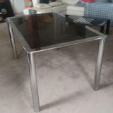 Dining table in chromed steel and smoked glass slab in 1969