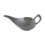 Old white porcelain pourer