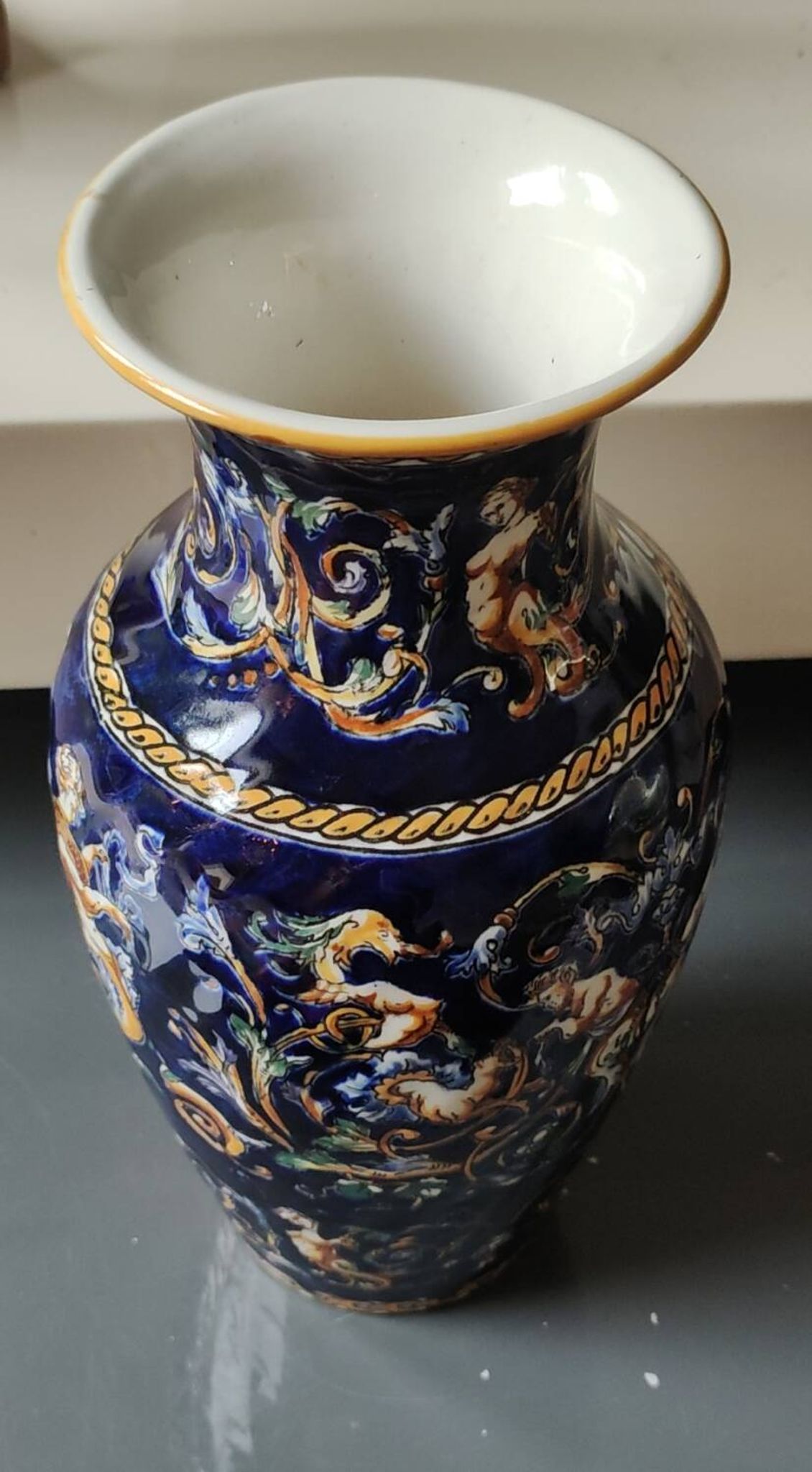 Twisted design vase. Signed Gien France/Renaissance blue background 26 x 13cm