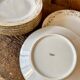 Set of 9 dessert plates in white and gold porcelain