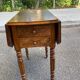 Victorian Pembroke table from the 19th century in walnut burr with drop-leaves.