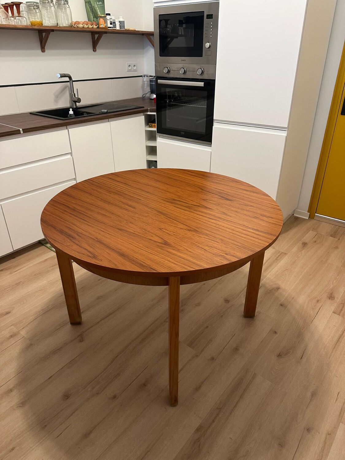 Wooden round table with butterfly extension from the 1970s.