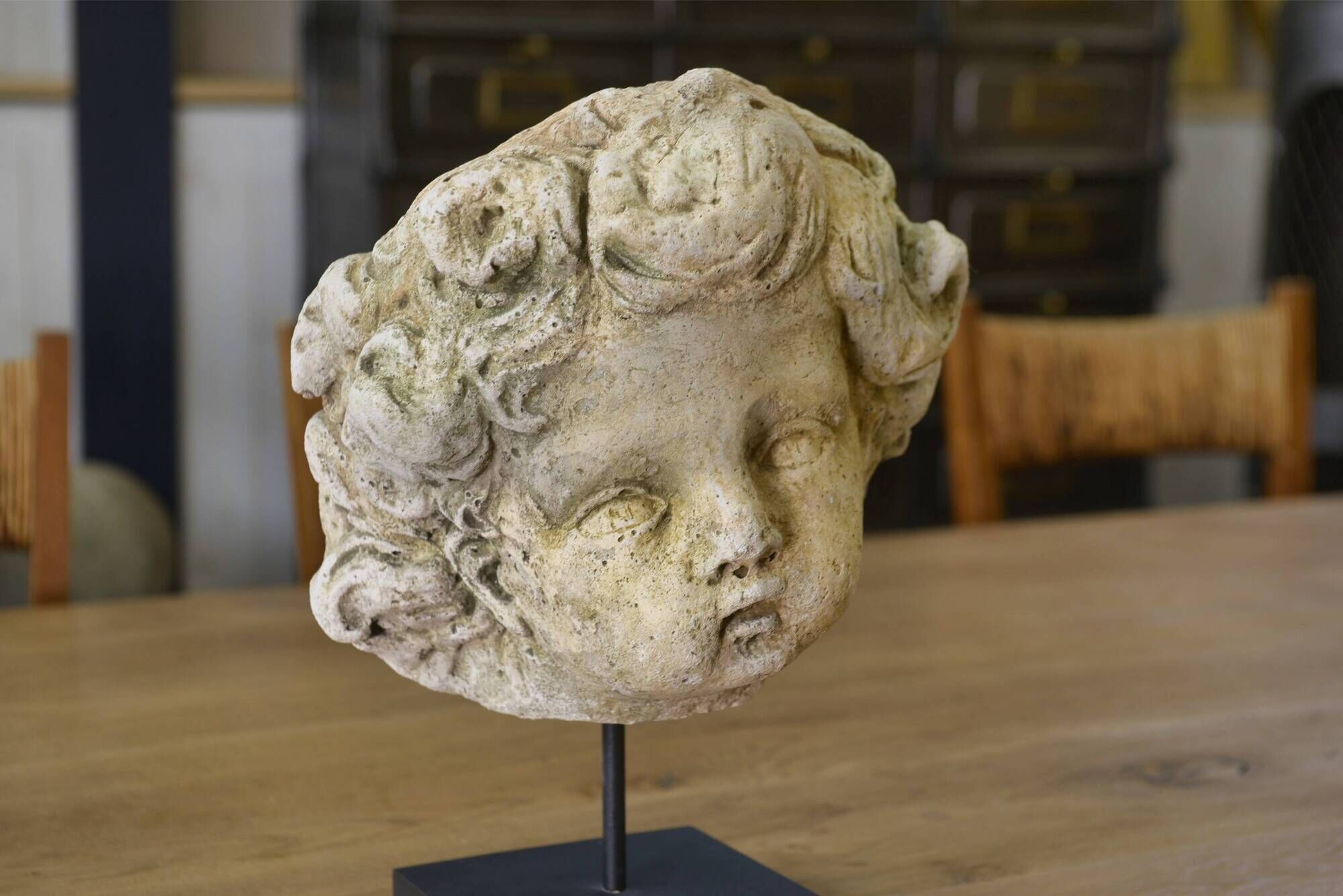 Reconstituted stone sculpture in antique style from the 20th century.