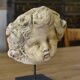 Reconstituted stone sculpture in antique style from the 20th century.