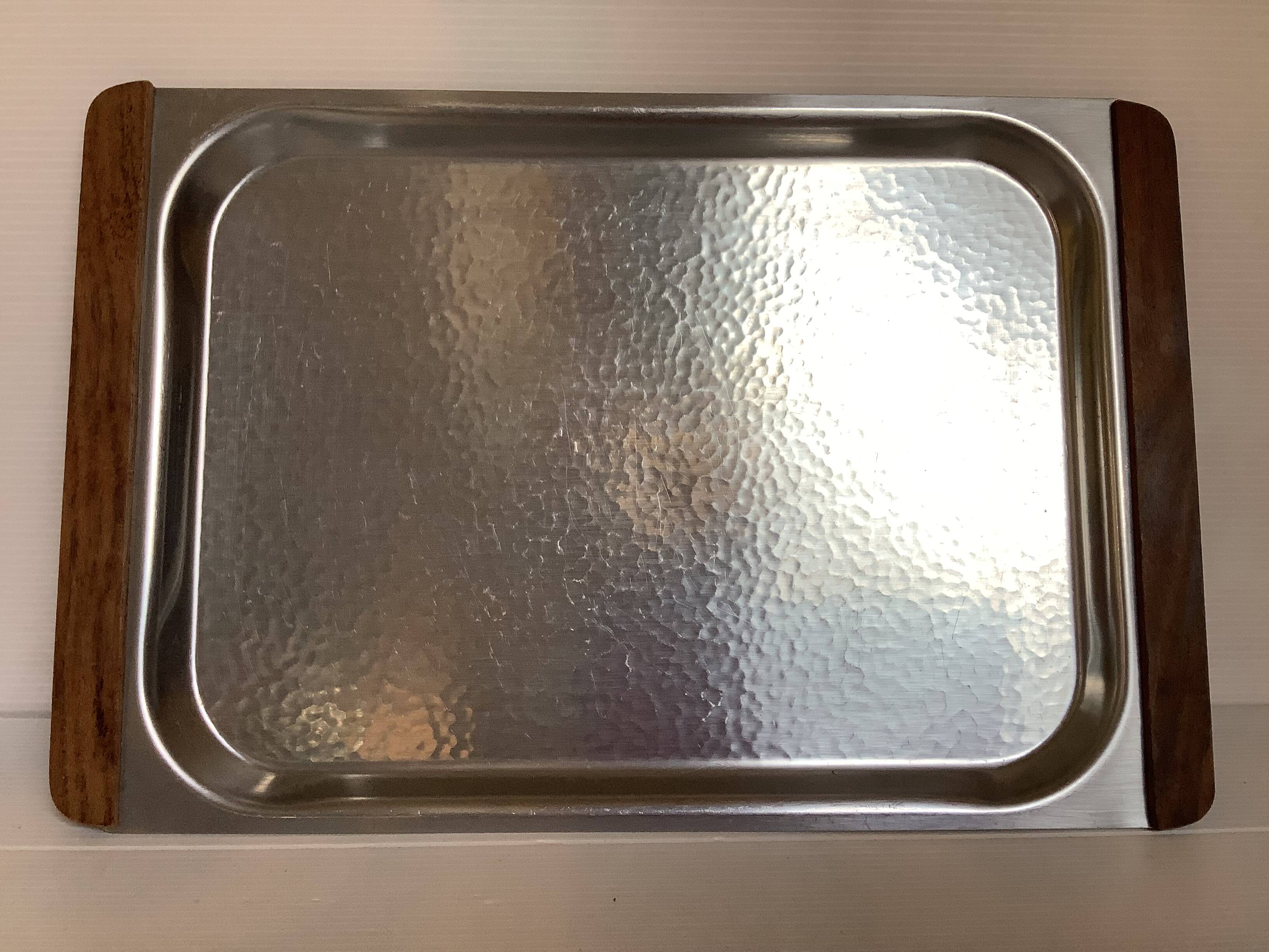 Small hammered metal and wood tray in Scandinavian style.