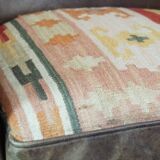 Nice, subtle cowhide armchair with a reversible kilim seat cushion