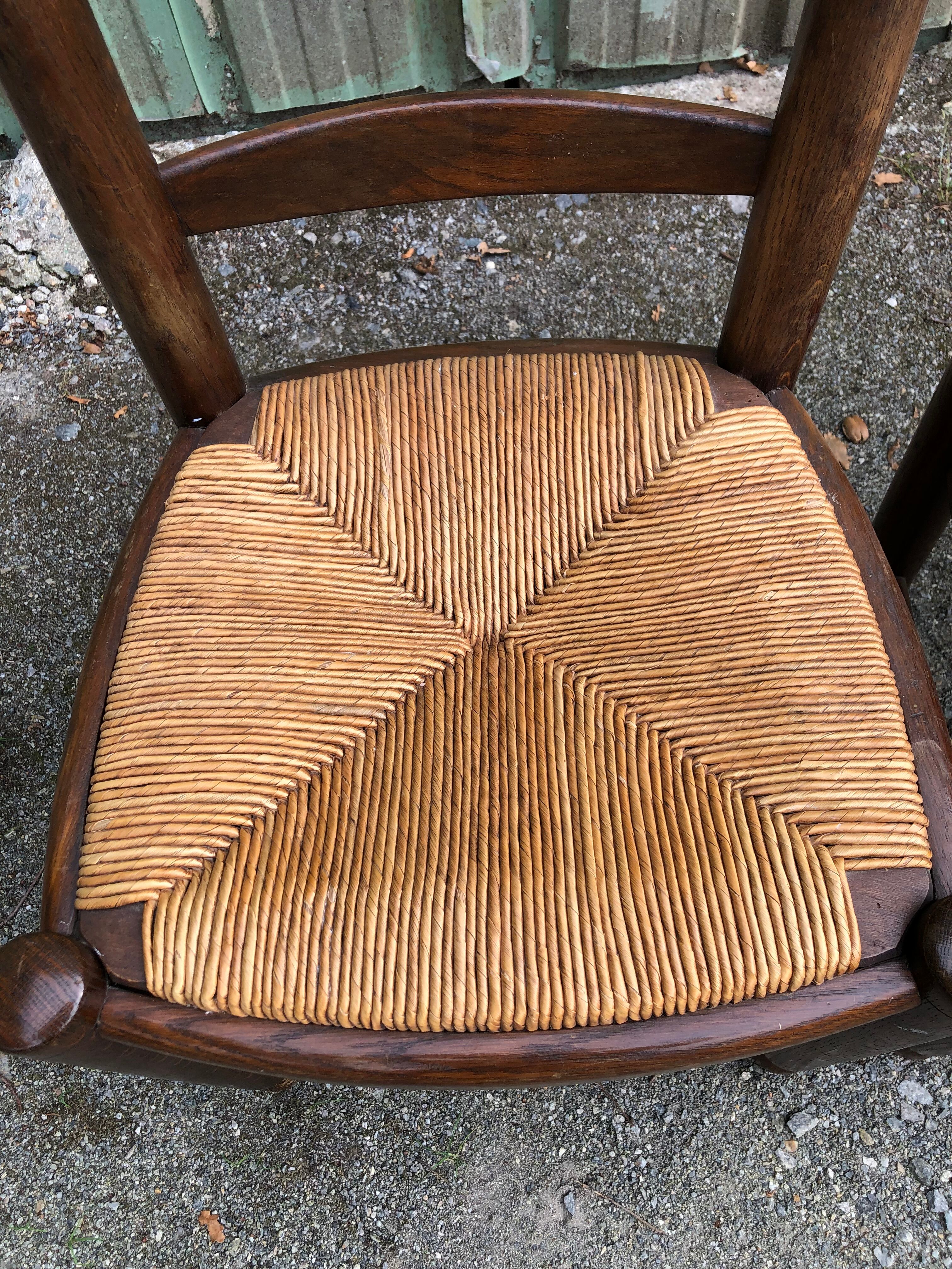 Duo of vintage rustic straw straw chairs in oak.