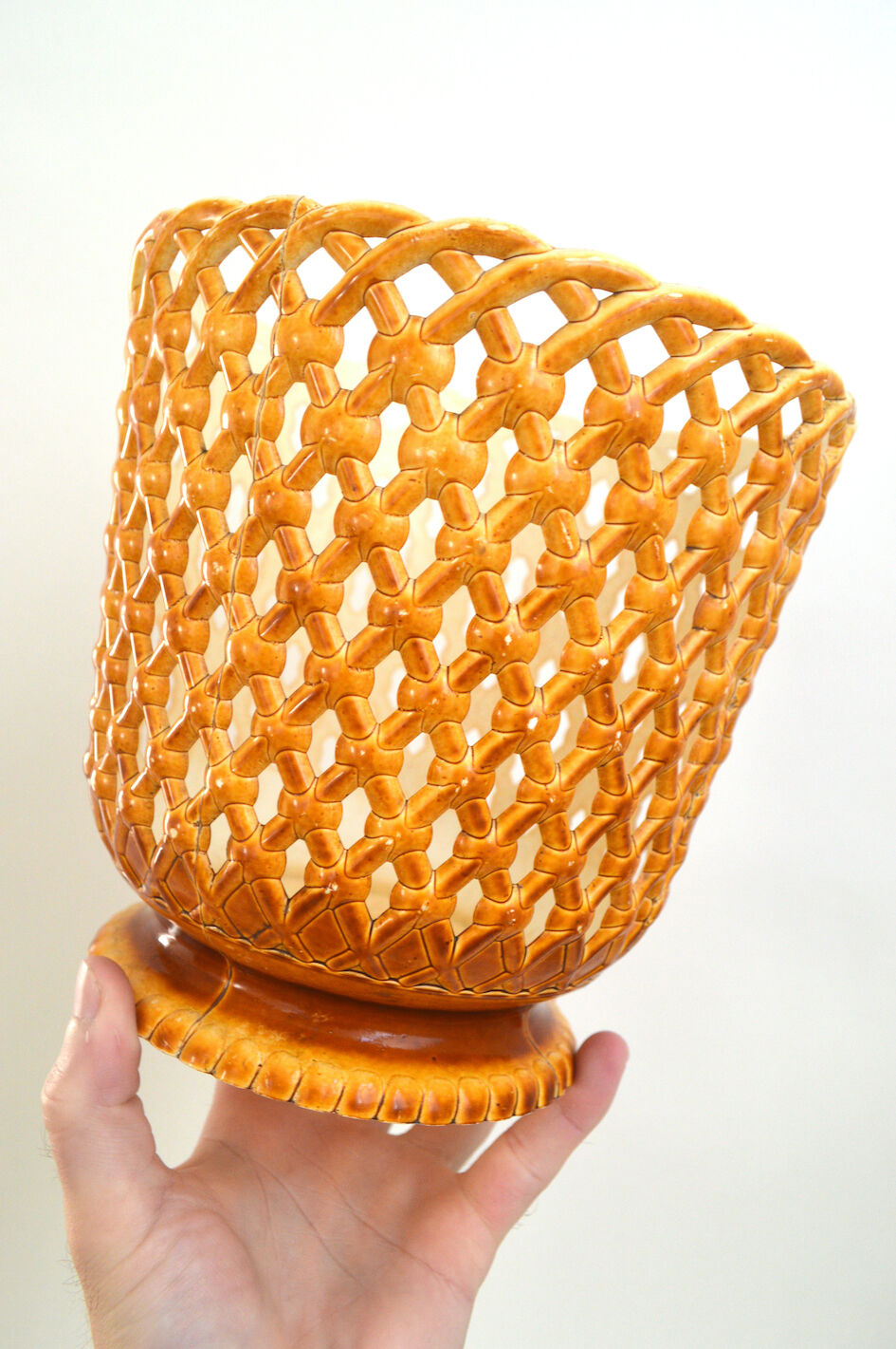Orange openwork pot cover
