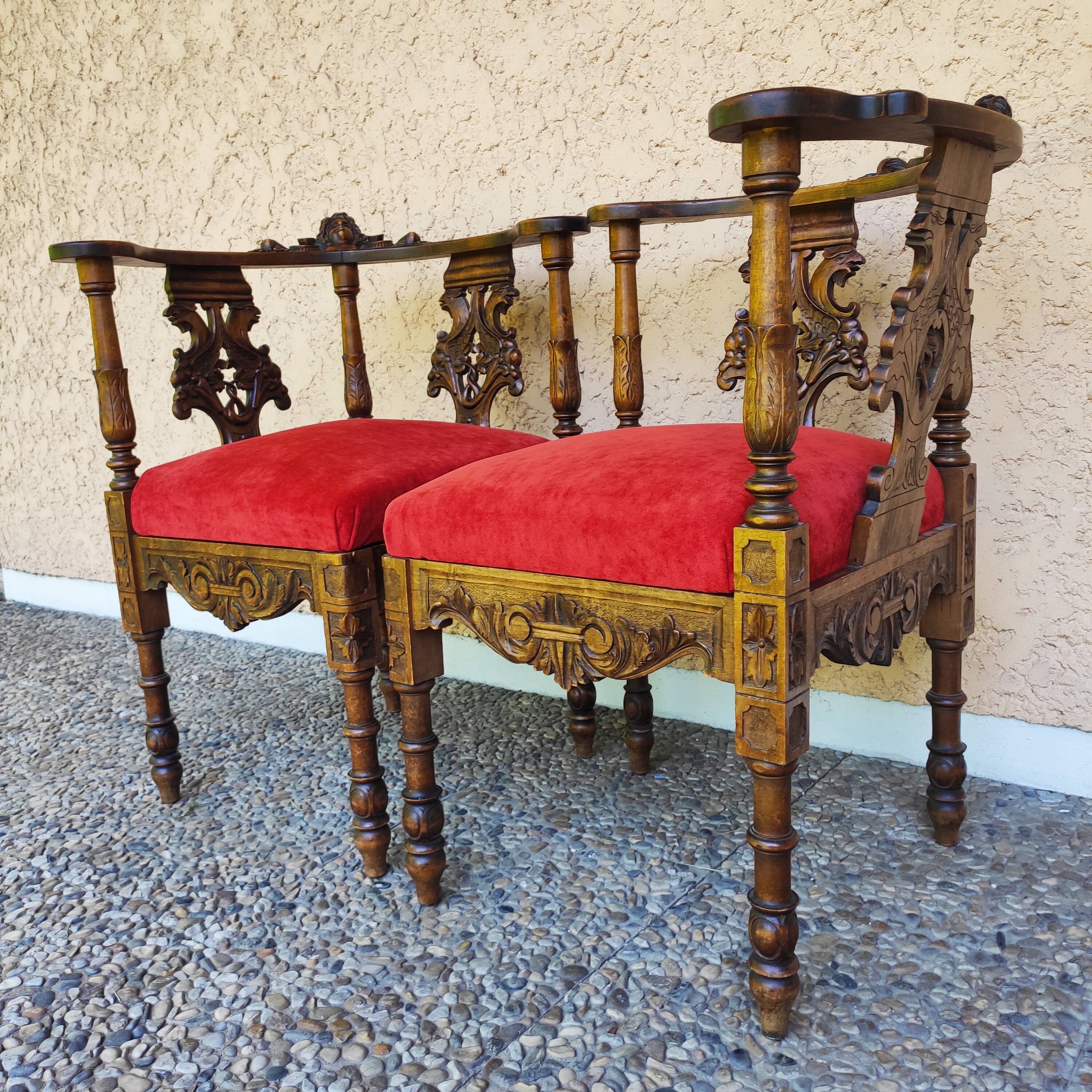 Pair of neo-Renaissance Henri II corner armchairs in carved wood, 19th century.